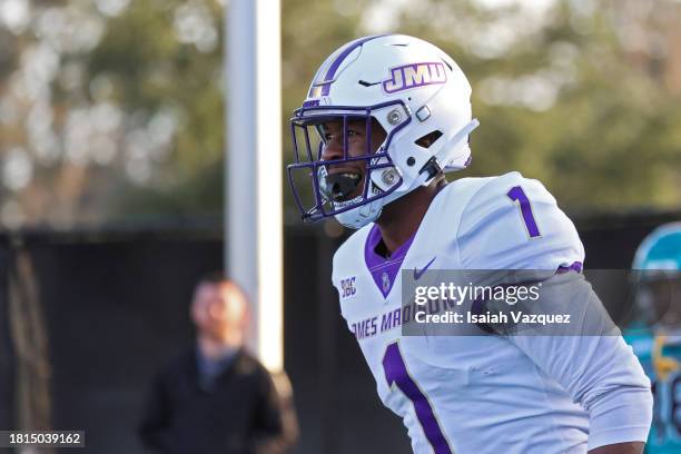 Reggie Brown of the James Madison Dukes smiles after scoring a touchdown in the second quarter against the Coastal Carolina Chanticleers at Brooks...