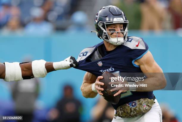 Brian Burns of the Carolina Panthers attempts to sack Will Levis of the Tennessee Titans during the first quarter at Nissan Stadium on November 26,...