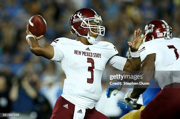 Quarterback King Davis III of the New Mexico State Aggies throws a pass against the UCLA Bruins at the Rose Bowl on September 21, 2013 in Pasadena,...