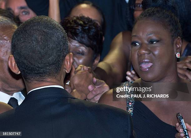 President Barack Obama greets Trayvon Martin's mother, Sybrina Fulton , and others in the crowd after delivering remarks at the Congressional Black...
