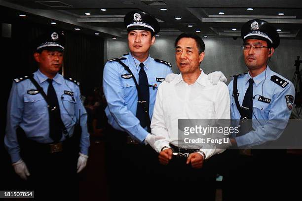 Screen shows the picture of the sentence of Chinese politician Bo Xilai on September 22, 2013 in Beijing, China. The Jinan Intermediate People's...