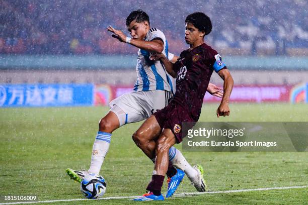 Juan Gimenez of Argentina plays against David Martinez of Venezuela during FIFA U-17 World Cup Round of 16 match between Argentina and Venezuela at...