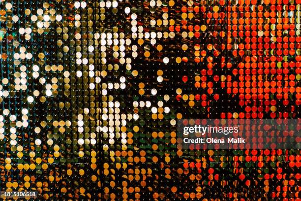 golden and red glittering background. new year and christmas celebration concept. - sequin stock pictures, royalty-free photos & images