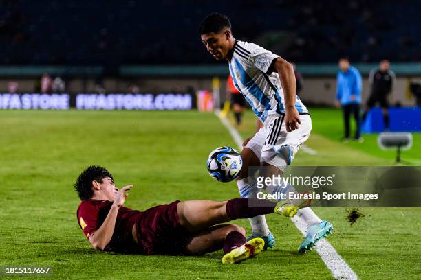 Pablo Ibarra of Venezuela battles for the ball with Ian Subiabre of Argentina during FIFA U-17 World Cup Round of 16 match between Argentina and...