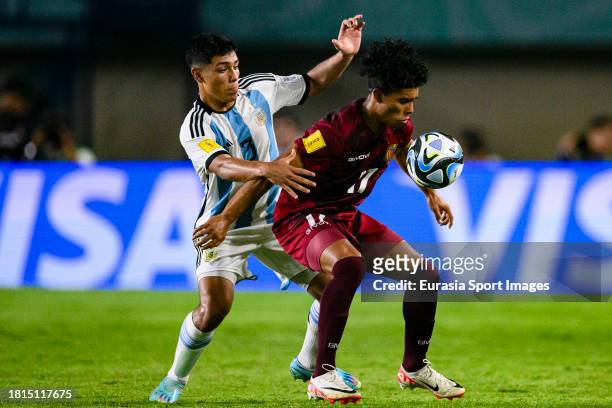 Octavio Ontivero of Argentina chases Maiken Gonzalez of Venezuela during FIFA U-17 World Cup Round of 16 match between Argentina and Venezuela at Si...