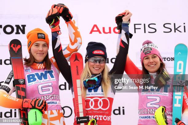 Petra Vlhova of Team Slovakia second place, Mikaela Shiffrin of Team USA first place and Wendy Holdener of Team Switzerland third place look on from...