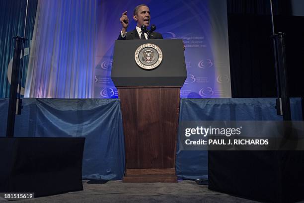 President Barack Obama boxed in by protective gear and teleprompters delivers remarks at the Congressional Black Caucus Foundation, Inc. Annual...