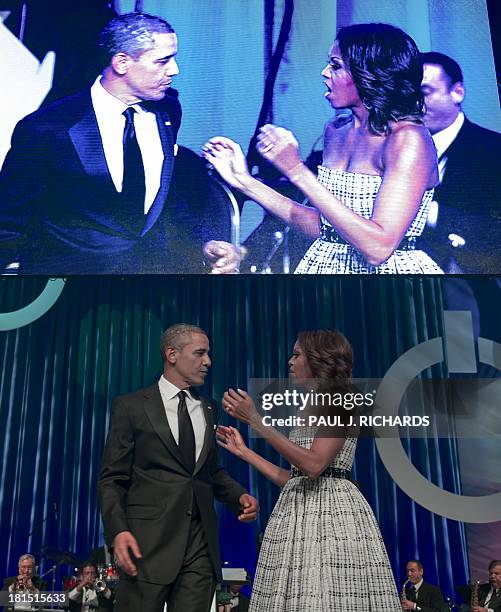 President Barack Obama and US First Lady are seen live and on a tv screen on the stage after he delivered remarks at the Congressional Black Caucus...