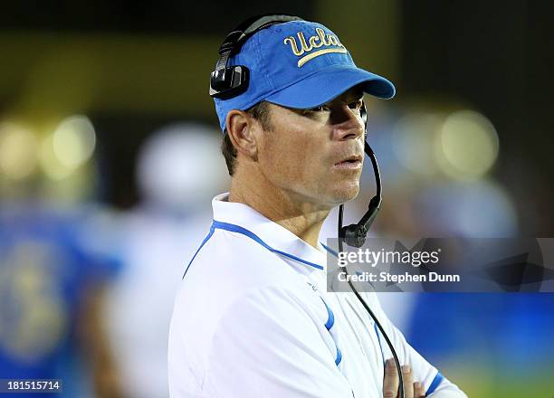 Head coach Jim Mora Jr. Of the UCLA Bruins looks on uring the game against the New Mexico State Aggies at the Rose Bowl on September 21, 2013 in...