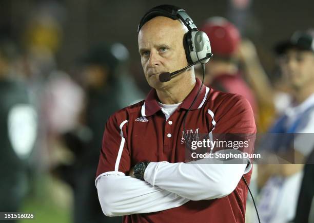 Head coach Doug Martin of the New Mexico State Aggies looks on during the game with the UCLA Bruins at the Rose Bowl on September 21, 2013 in...