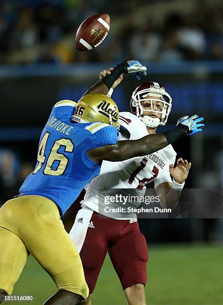 Linebacker Kenny Orijoke of the UCLA Bruins breaks up a pass by quarterback Andrew McDonald of the New Mexico State Aggies at the Rose Bowl on...