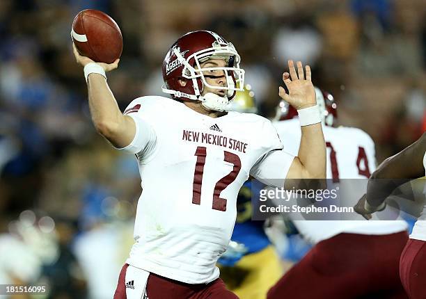 Quarterback Andrew McDonald of the New Mexico State Aggies throws a pass against the UCLA Bruins at the Rose Bowl on September 21, 2013 in Pasadena,...