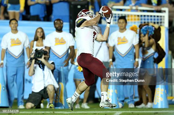 Wide receiver Adam Shapiro of the New Mexico State Aggies catches a 33 yard touchdown pass in the fourth quarter against the UCLA Bruins at the Rose...