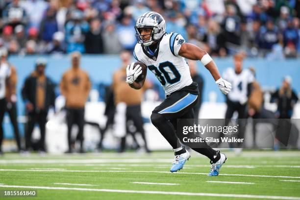 Chuba Hubbard of the Carolina Panthers runs the ball during the third quarter against the Tennessee Titans at Nissan Stadium on November 26, 2023 in...