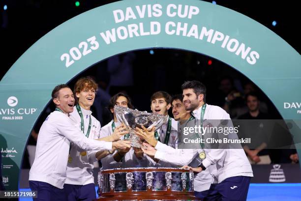 Filippo Volandri, Jannik Sinner, Lorenzo Musetti, Matteo Arnaldi, Lorenzo Sonego and Simone Bolelli of Italy lift the Davis Cup Trophy after their...