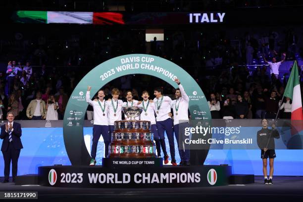 Filippo Volandri, Jannik Sinner, Lorenzo Musetti, Matteo Arnaldi, Lorenzo Sonego and Simone Bolelli of Italy lift the Davis Cup Trophy after their...