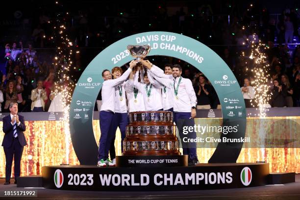 Filippo Volandri, Jannik Sinner, Lorenzo Musetti, Matteo Arnaldi, Lorenzo Sonego and Simone Bolelli of Italy lift the Davis Cup Trophy after their...