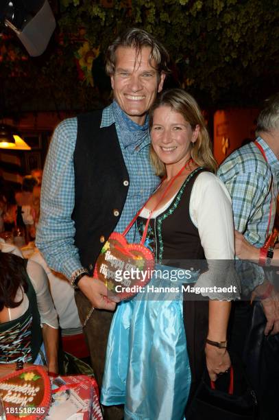 Goetz Otto and his wife Sabine attend the Oktoberfest beer festival at Theresienwiese on September 21, 2013 in Munich, Germany.