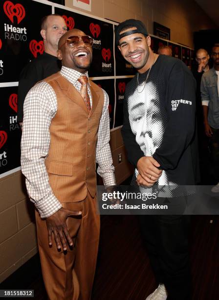 Professional boxer Floyd Mayweather Jr. And singer Drake attend the iHeartRadio Music Festival at the MGM Grand Garden Arena on September 21, 2013 in...