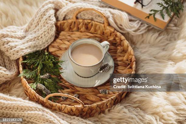 cozy winter composition with coffee and warm scarf - décembre photos et images de collection
