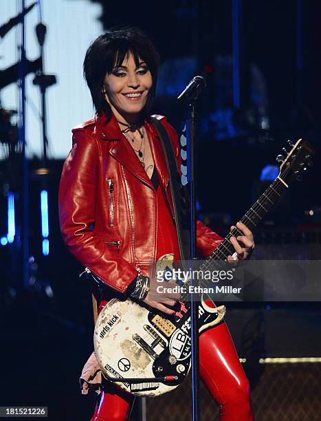 Joan Jett performs with Ke$ha onstage during the iHeartRadio Music Festival at the MGM Grand Garden Arena on September 21, 2013 in Las Vegas, Nevada.