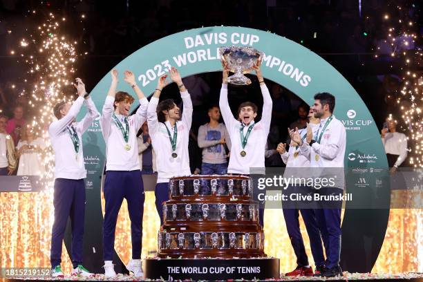 Filippo Volandri, Jannik Sinner, Lorenzo Musetti, Matteo Arnaldi, Lorenzo Sonego and Simone Bolelli of Italy lift the Davis Cup Trophy after their...