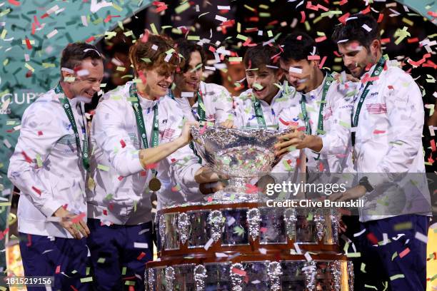 Filippo Volandri, Jannik Sinner, Lorenzo Musetti, Matteo Arnaldi, Lorenzo Sonego and Simone Bolelli of Italy lift the Davis Cup Trophy after their...