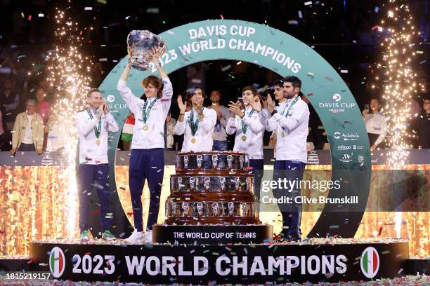 Filippo Volandri, Jannik Sinner, Lorenzo Musetti, Matteo Arnaldi, Lorenzo Sonego and Simone Bolelli of Italy lift the Davis Cup Trophy after their...