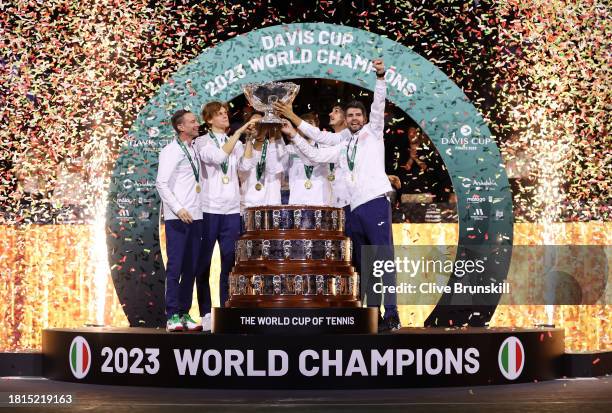 Filippo Volandri, Jannik Sinner, Lorenzo Musetti, Matteo Arnaldi, Lorenzo Sonego and Simone Bolelli of Italy lift the Davis Cup Trophy after their...