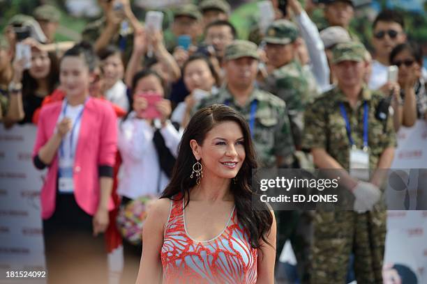 Actress Catherine Zeta-Jones of Britain arrives for a red carpet event during a groundbreaking ceremony for the ambitious "Oriental Movie...