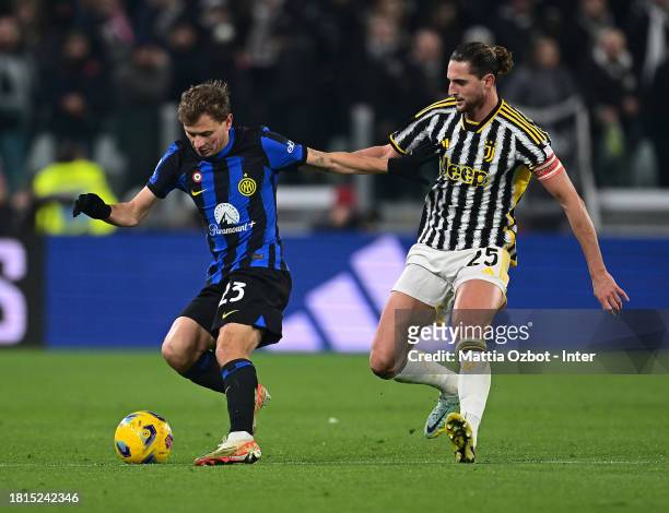 Nicolo Barella of FC Internazionale competes for the ball with Adrien Rabiot of Juventus during the Serie A TIM match between Juventus and FC...