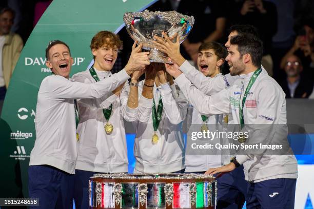 Filippo Volandri, Jannik Sinner, Lorenzo Musetti, Matteo Arnaldi, Lorenzo Sonego and Simone Bolelli of Italy lift the Davis Cup Trophy after their...