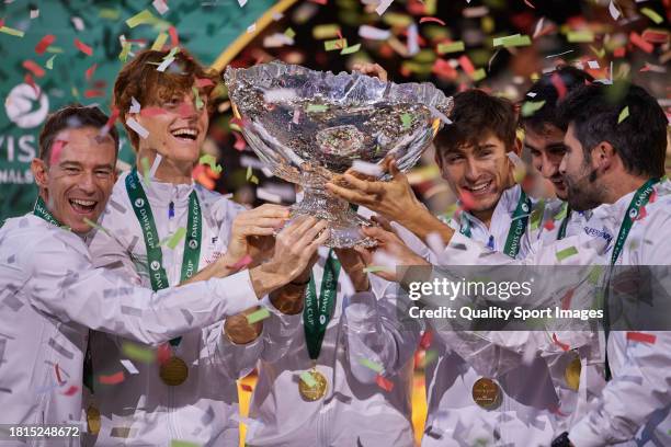 Filippo Volandri, Jannik Sinner, Lorenzo Musetti, Matteo Arnaldi, Lorenzo Sonego and Simone Bolelli of Italy lift the Davis Cup Trophy after their...