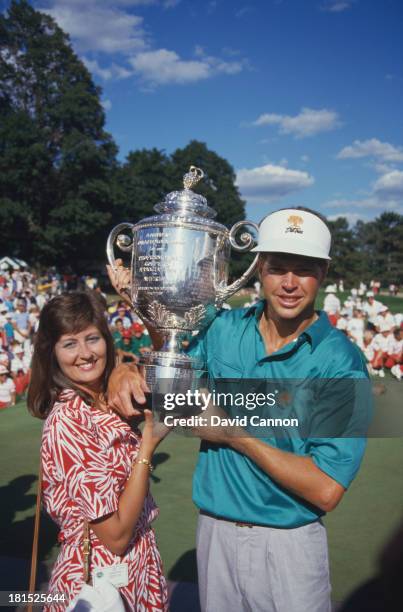 American golfer Bob Tway and his wife, Tammie, with the trophy after Tway won the PGA Championship at Inverness Club in Toledo, Ohio 11th August...