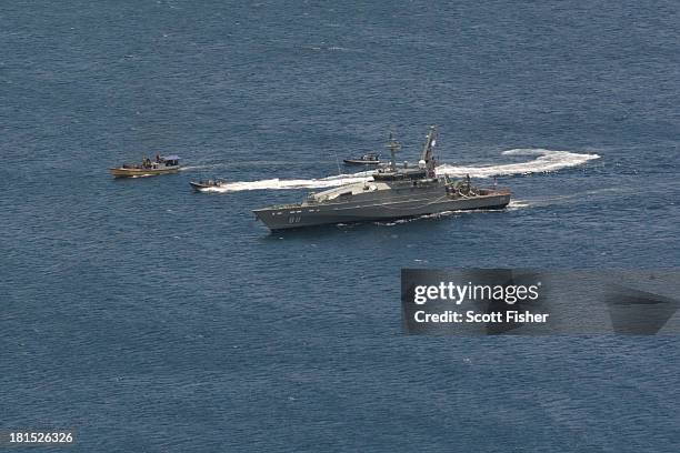 Suspected asylum seeker vessel arrives at Flying Fish Cove, Christmas Island, after being intercepted and escorted by the Australian Navy, on...