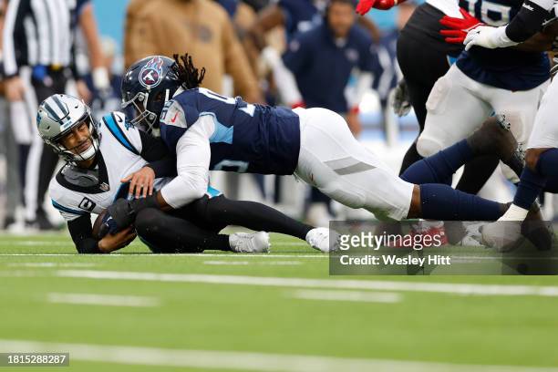 Denico Autry of the Tennessee Titans sacks Bryce Young of the Carolina Panthers during the second half of the game at Nissan Stadium on November 26,...
