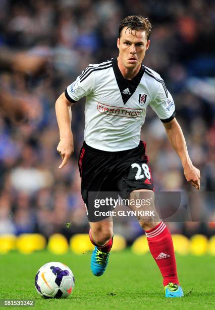 Fulham's English midfielder Scott Parker runs with the ball during the English Premier League football match between Chelsea and Fulham at Stamford...