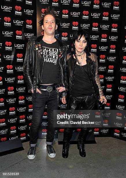 Guitarist Dougie Needles and singer Joan Jett arrive at the iHeartRadio Music Festival official closing party at the Light Nightclub at the Mandalay...