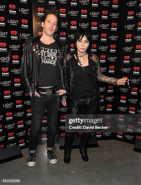 Guitarist Dougie Needles and singer Joan Jett arrive at the iHeartRadio Music Festival official closing party at the Light Nightclub at the Mandalay...