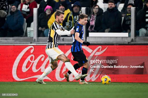 Daniele Rugani of Juventus battles for the ball with Nicolo Barella of FC Internazionale during the Serie A TIM match between Juventus and FC...