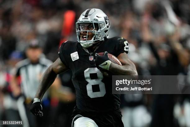 Josh Jacobs of the Las Vegas Raiders runs for a second quarter touchdown against the Kansas City Chiefs at Allegiant Stadium on November 26, 2023 in...