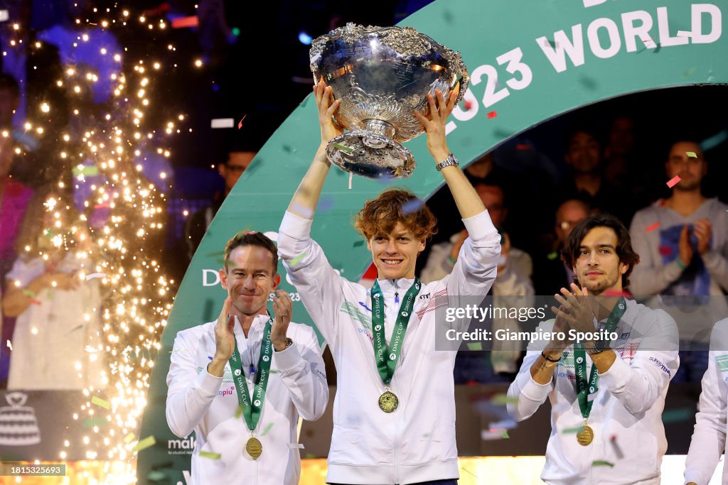 Jannik Sinner of Italy holds the Davis Cup Trophy after their teams
