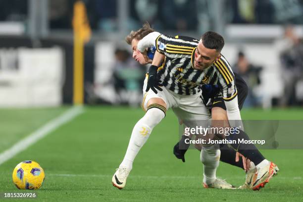 Filip Kostic of Juventus clashes with Nicolo Barella of FC Internazionale during the Serie A TIM match between Juventus and FC Internazionale at on...