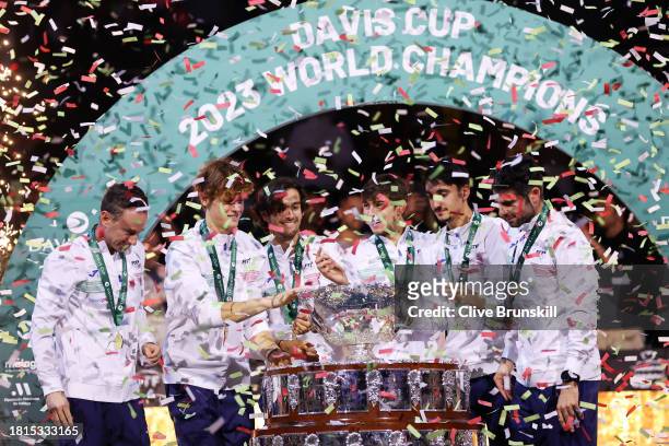 Filippo Volandri, Jannik Sinner, Lorenzo Musetti, Matteo Arnaldi, Lorenzo Sonego and Simone Bolelli of Italy celebrate with the Davis Cup Trophy...