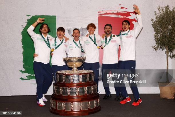 Lorenzo Musetti, Matteo Arnaldi, Filippo Volandri, Jannik Sinner, Simone Bolelli and Lorenzo Sonego of Italy celebrate with the Davis Cup trophy...