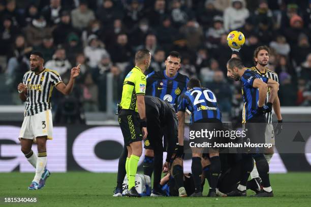 Nicolo Barella of FC Internazionale receivbes treatment after taking a knock during the Serie A TIM match between Juventus and FC Internazionale at...