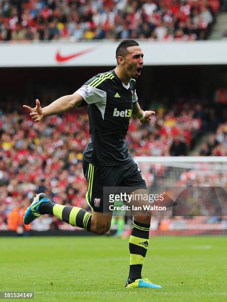 Geoff Cameron of Stoke City celebrates scoring during the Barclays Premier League match between Arsenal and Stoke City at Emirates Stadium on...