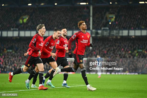 Marcus Rashford of Manchester United celebrates with team mates after scoring a penalty to make it 2-0 during the Premier League match between...