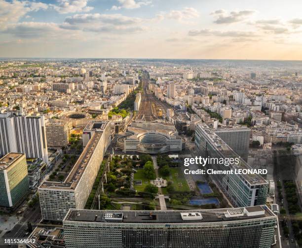 aerial view of the gare montparnasse (montparnasse train station) at sunset, paris, ile-de-france (ile de france), central france. - tour montparnasse stock pictures, royalty-free photos & images