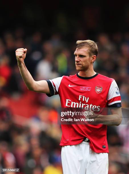 Per Mertesacker of Arsenal celebrates victory after the Barclays Premier League match between Arsenal and Stoke City at Emirates Stadium on September...